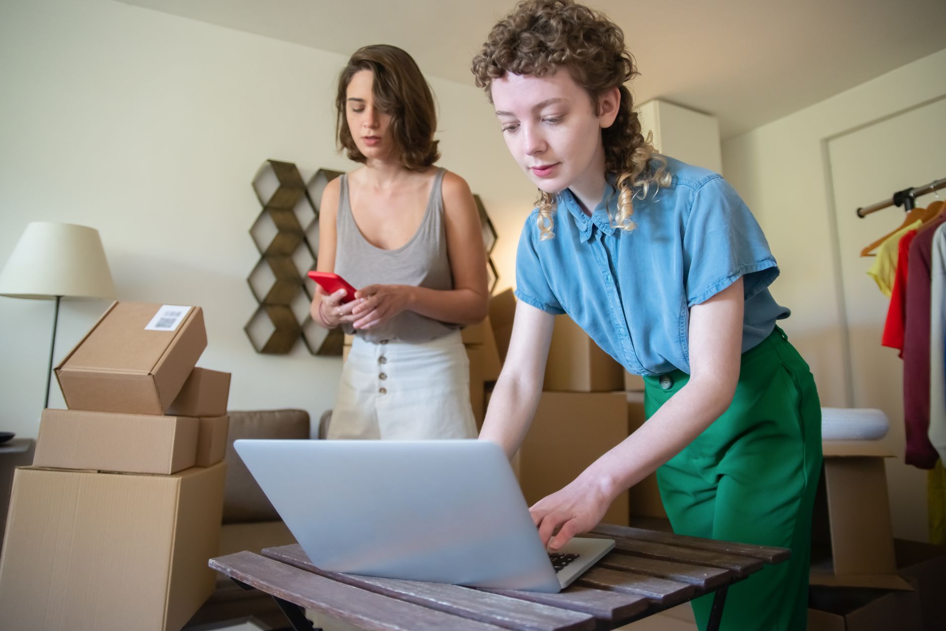 Online store team managing orders and inventory on a laptop, the kind of work you can do by chatting with your Shopware store through Claude