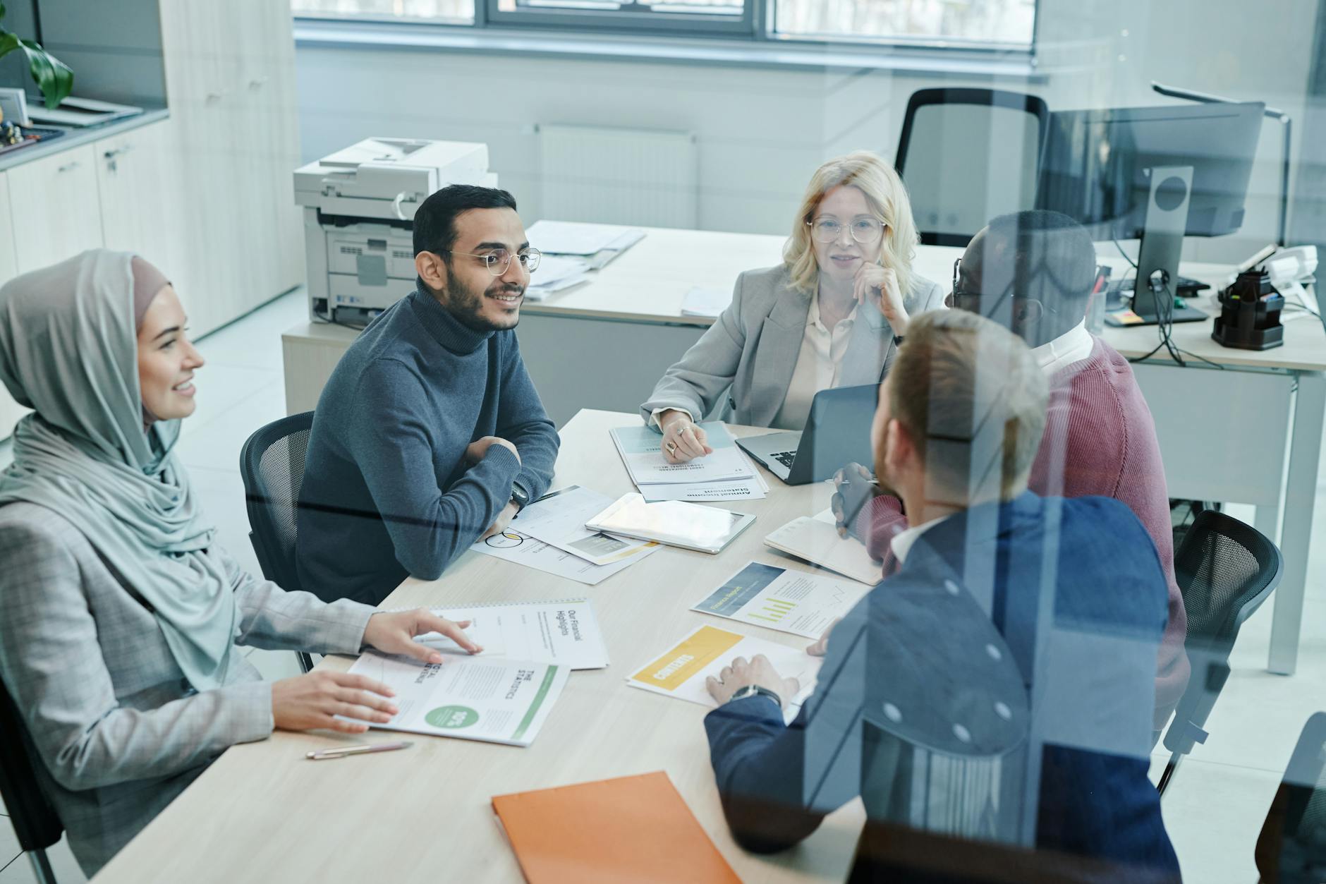 Marketing team meeting for weekly Slack report planning